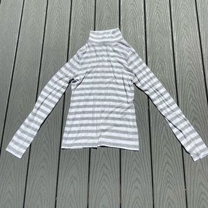 White long sleeve turtle neck with grey stripes.